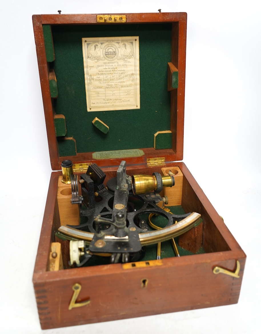 A mid 20th century sextant by Henry Hughes & Son Ltd., in a fitted mahogany case, with detailed labels to the inside of the lid. Condition - good.